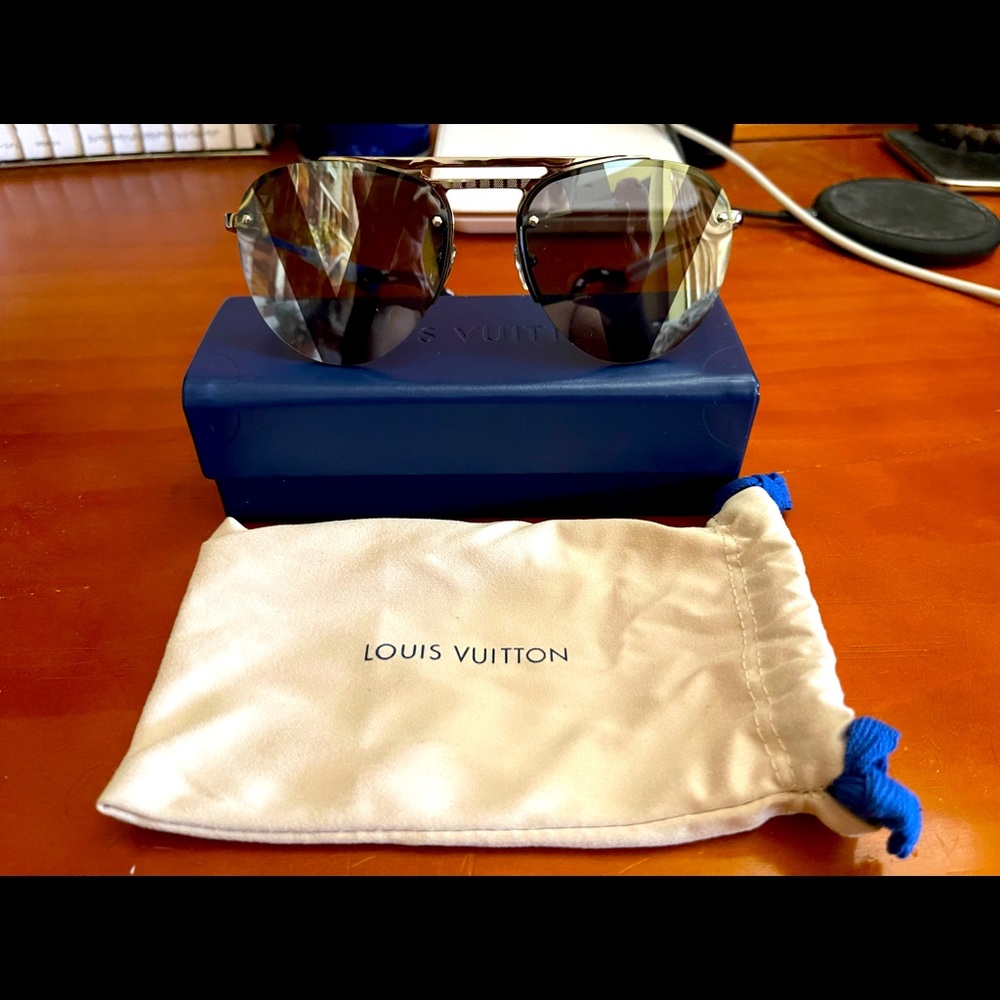 Authentic Louis Vuitton Latitude pliant Glass.